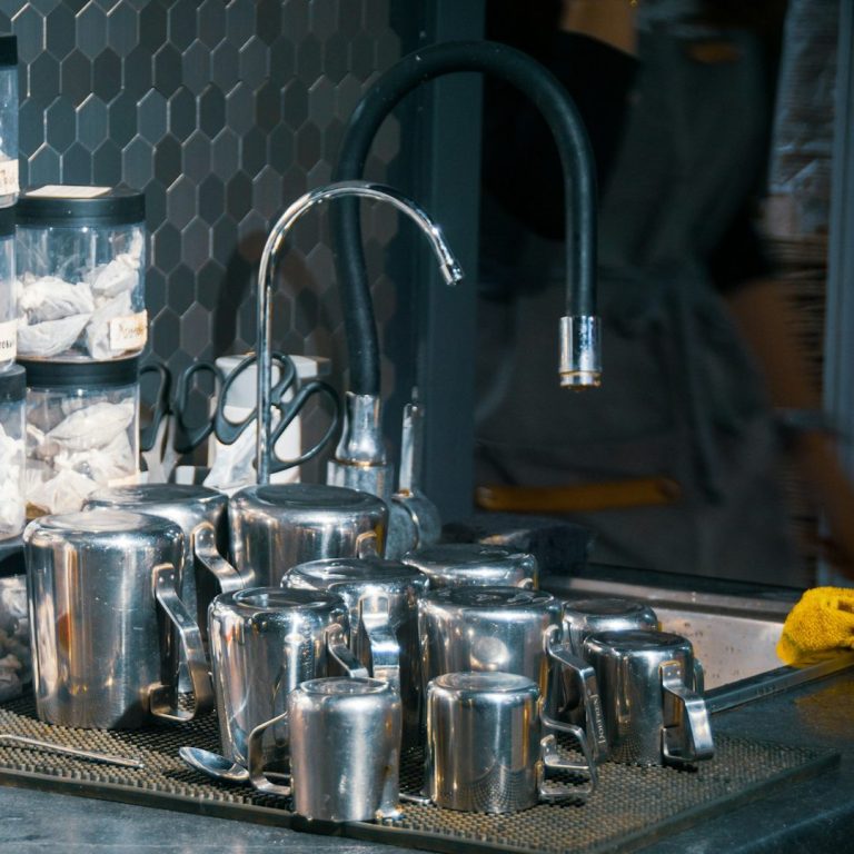 A stainless steel dishwasher with digital display and controls.